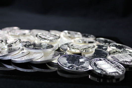 A collection of silver and platinum coins