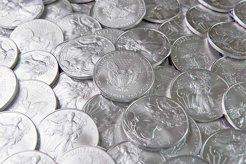 Image of a pile of American Silver Eagle Coins showing contenders for the best silver coins