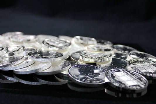 A messy pile of silver bullion coins