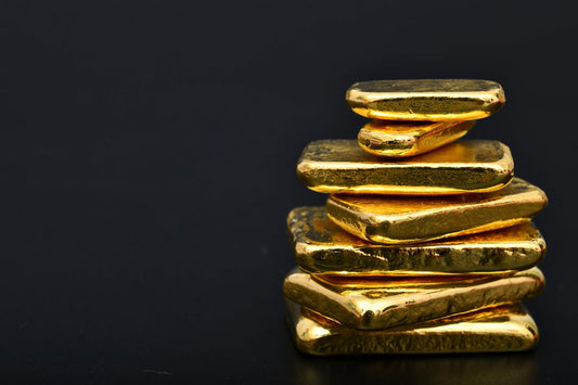 A stack of rough gold bullion bars